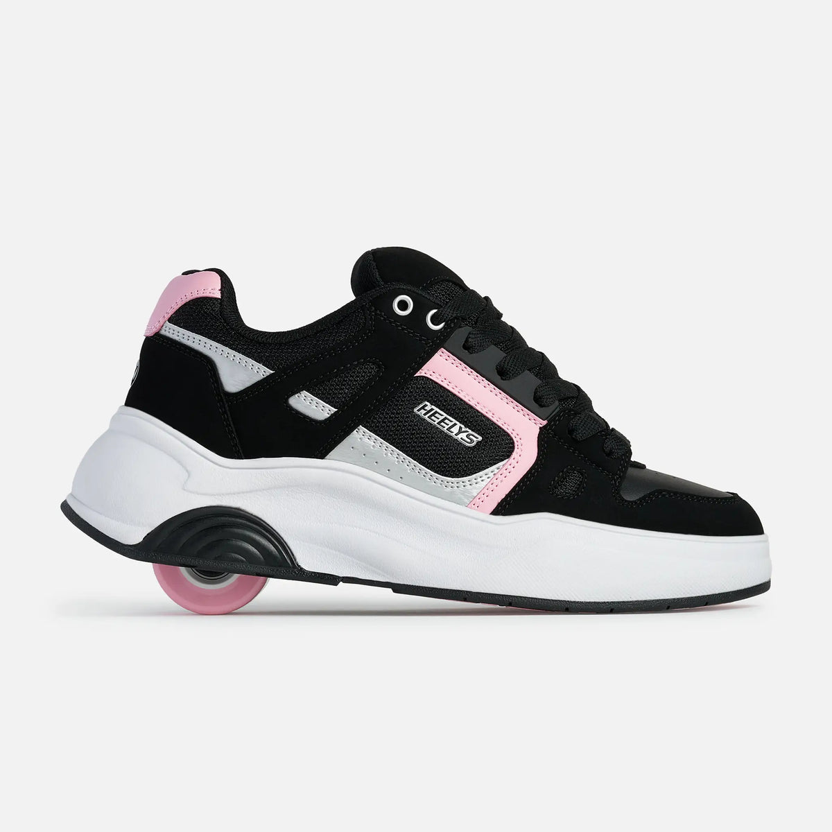 A black and white sneaker with pink accents and a pink wheel, shown from the side on a light gray background. The brand name 'NEKTS' is visible on the side of the shoe.