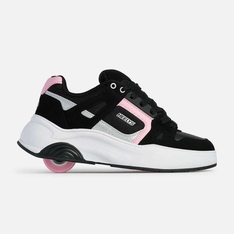A black and white sneaker with pink accents and a pink wheel, shown from the side on a light gray background. The brand name 'NEKTS' is visible on the side of the shoe.