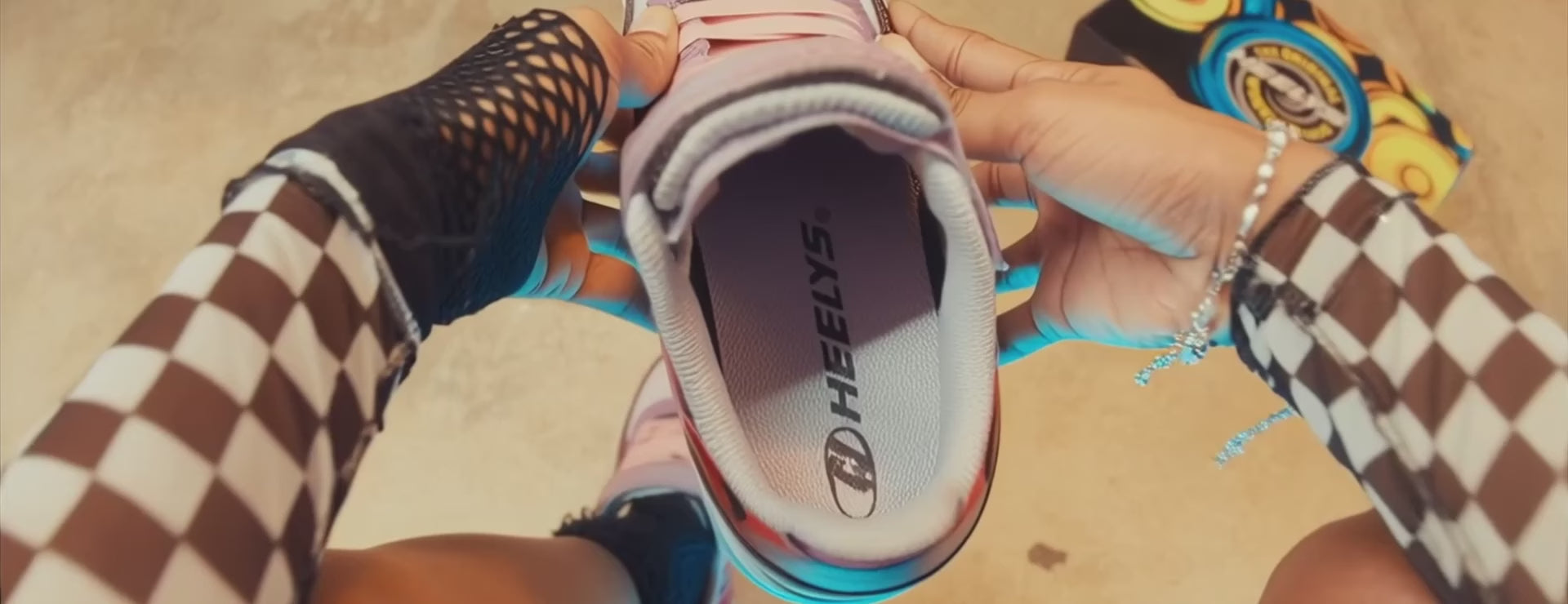 Heelys are athletic-style shoes with a wheel in the heel that allow kids to transition from walking to rolling.