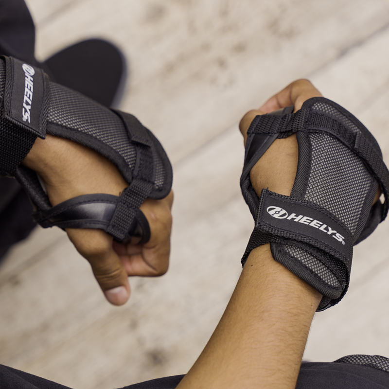 Person wearing Heelys protective wrist pads.